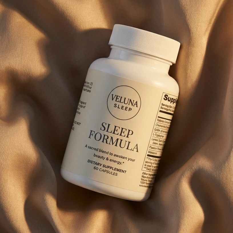 Veluna Sleep Formula Capsules bottle lying on draped tan satin with long evening shadows, seen from above