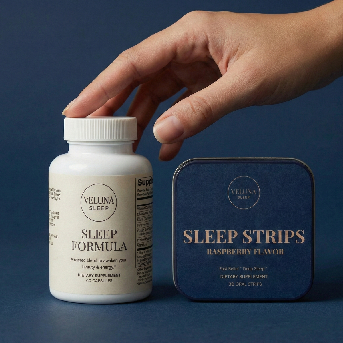 Veluna Mind Calm Booster Bundle on navy, a hand touching the Sleep Formula cap beside the Sleep Strips tin