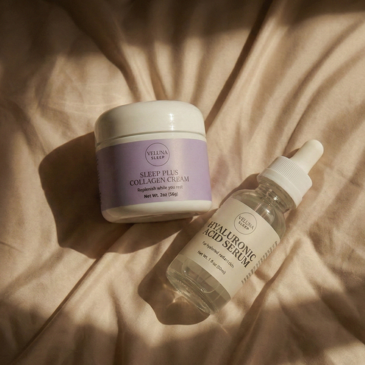 Veluna Sacred Soothe Starter Bundle, lavender night cream jar and serum dropper bottle lying on sunlit bedding
