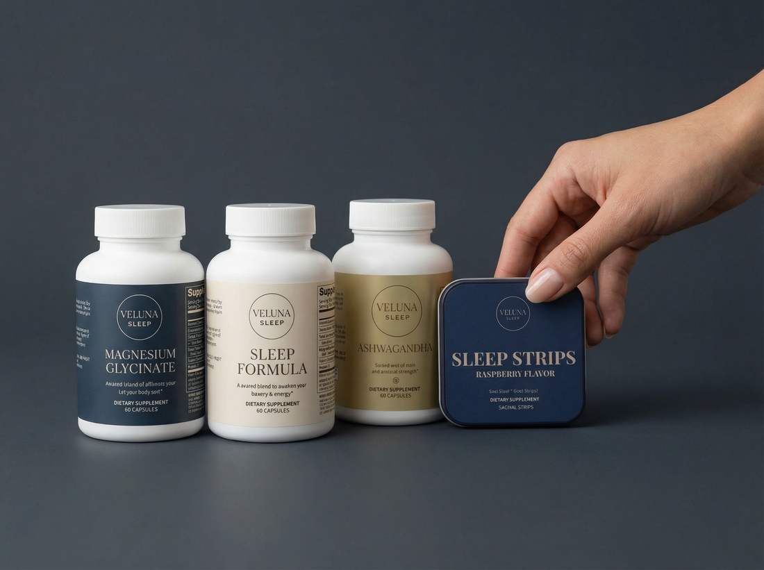 Veluna Mind Calm Full Bundle on charcoal, three capsule bottles in a row and a hand holding the Sleep Strips tin