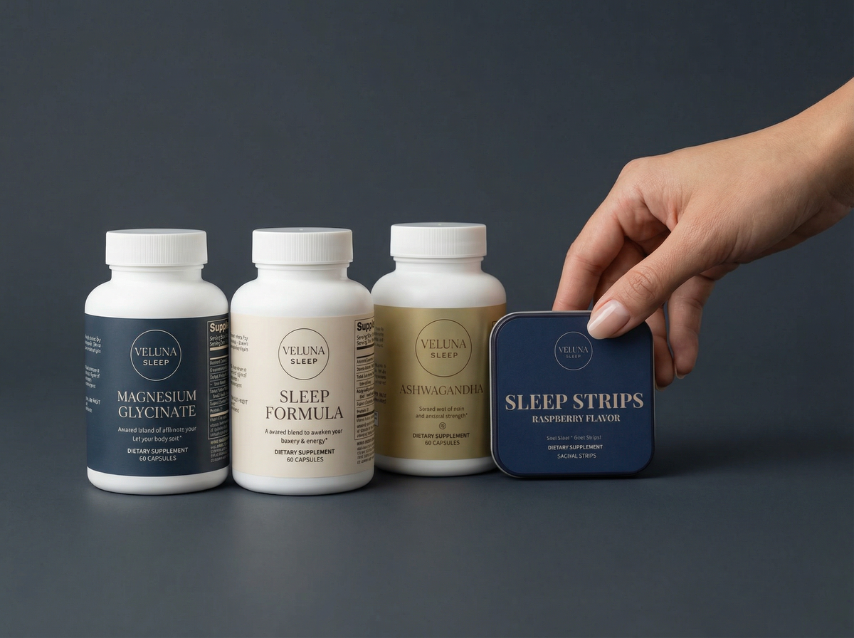 Veluna Mind Calm Full Bundle on charcoal, three capsule bottles in a row and a hand holding the Sleep Strips tin