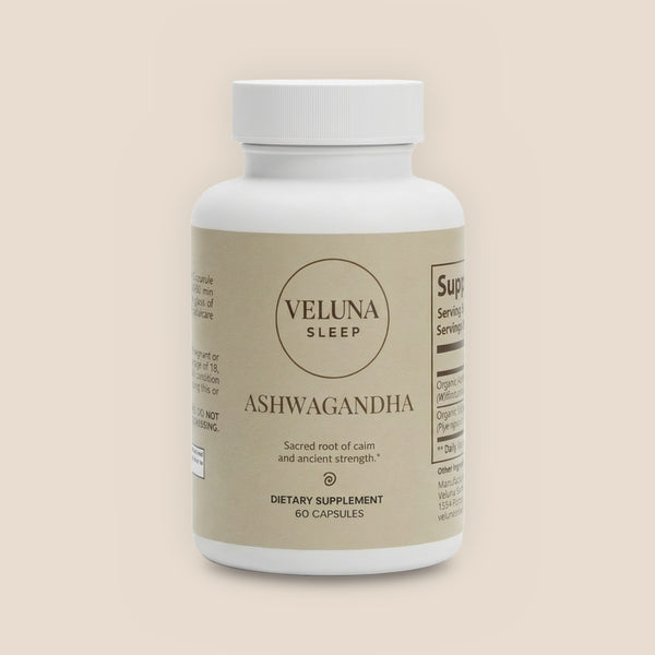 Veluna Organic Ashwagandha Capsules, 60-count bottle with a beige label, pack shot on a warm linen background