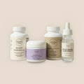 Veluna Sacred Soothe Full Bundle, Sleep Formula, Sleep Plus Collagen Night Cream, Ashwagandha and serum on white, on a warm linen background